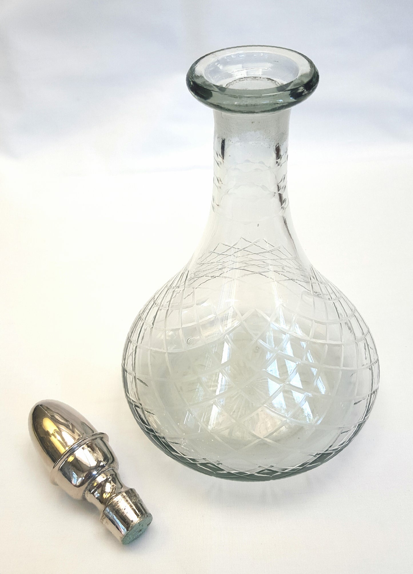 Vintage Hand-Cut Glass Decanter with Intricate Pattern