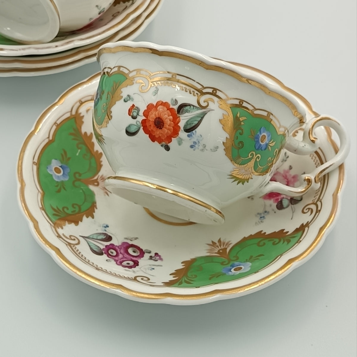 English Porcelain | Part Tea Service | Green Ground with Gilt Acanthus and Hand-Painted Flower Reserves | Pattern 239 | c.1820–1840 | 13 Pieces