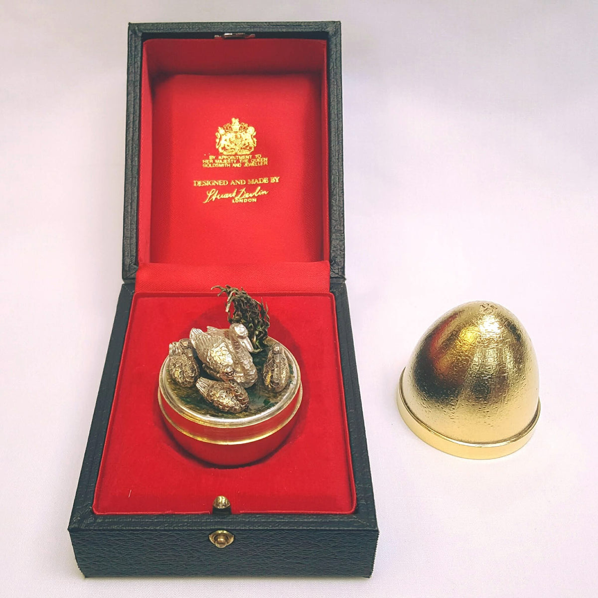 Stuart Devlin | Silver-Gilt 'Surprise' Egg | Mother Swan & Three Cygnets with Green Enamel Foliage | Limited Edition No. 70 | London Hallmarked 1984 | Royal Warrant Presentation Case | Exceptional Collector's Piece