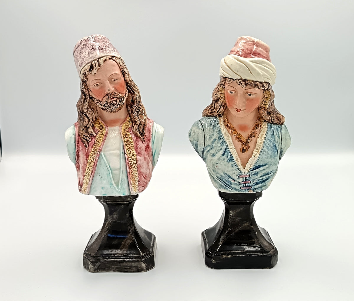 Pair of Orientalist Pottery Busts on Pedestals