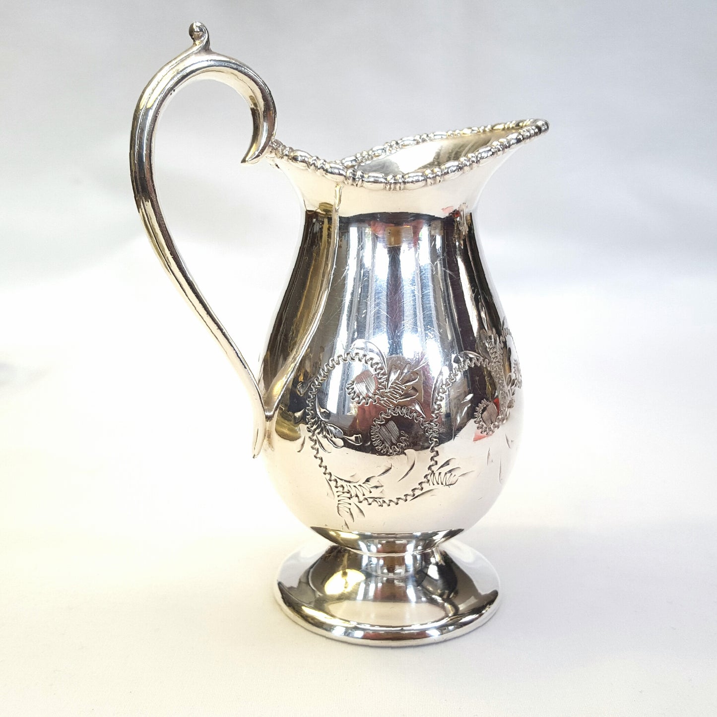Elegant Antique Viners Silver-Plated Milk Jug with Scroll Engraving